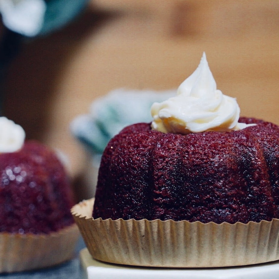red velvet bundt cake with vanilla cream cheese frosting