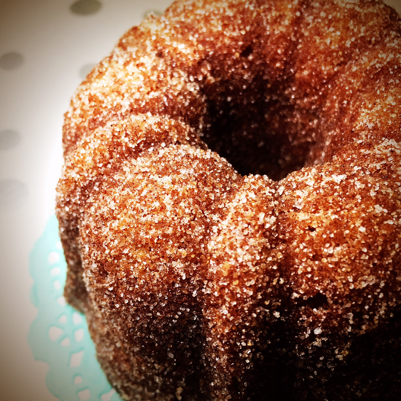 all spice bundt cake with horchata glaze dusted in cinnamon sugar